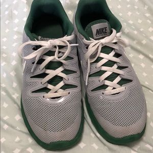Green and white nike shoes